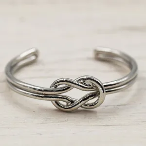 Delicate open bangle with rope knot feature