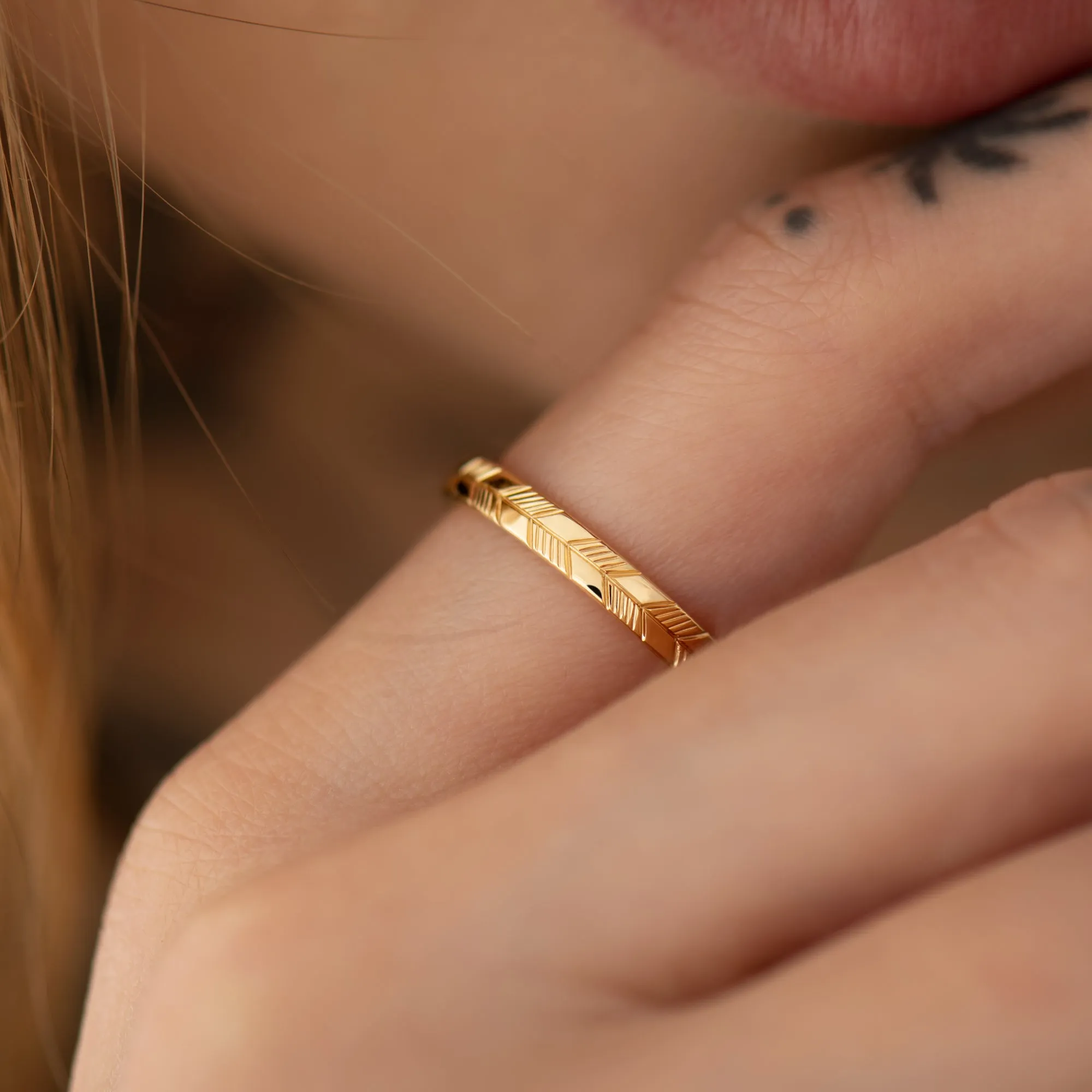Golden Wedding Band with an Abstract Feather Engraving